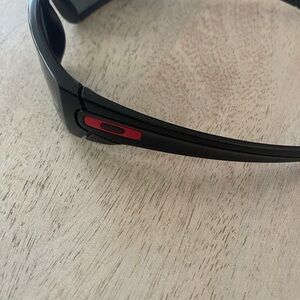 Oakley Sunglasses with Black Frame and Red Accent